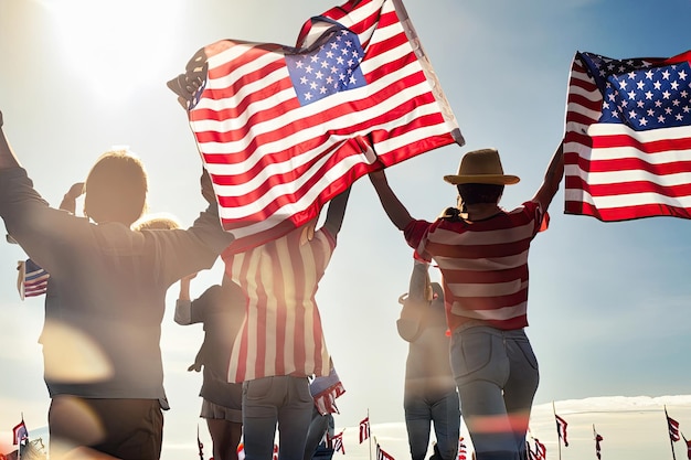 A group of people holding american flags