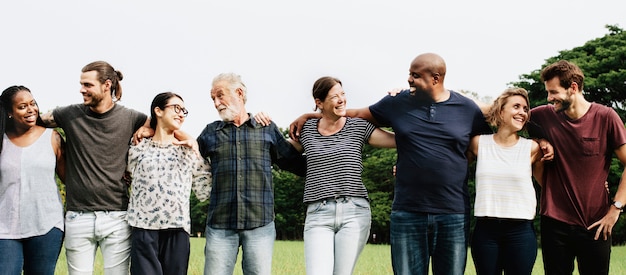 Group of people hugging each other in the park