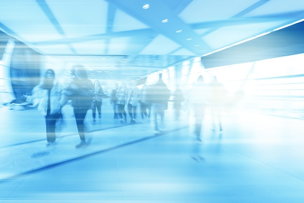 group of people movement blurred light background inside