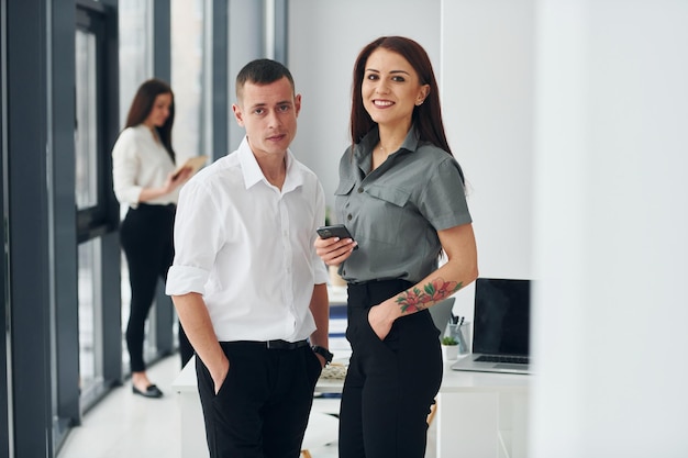 Group of people in official formal clothes that is indoors in the office