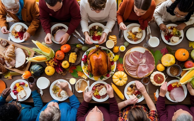 Photo a group of people sit around a table with a turkey on it