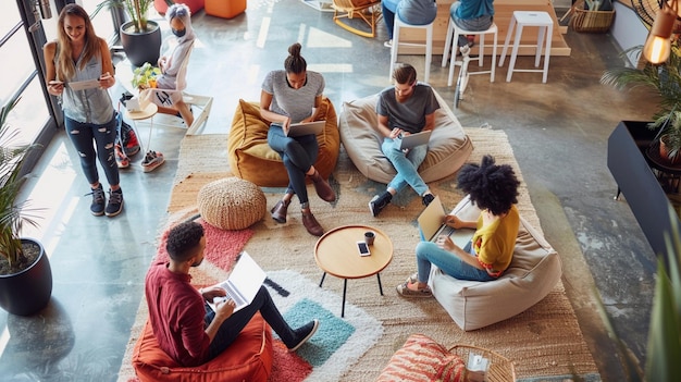 a group of people sit on couches reading books and reading books and watching a laptop