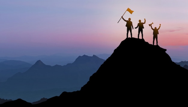 Group of people standing on a mountain