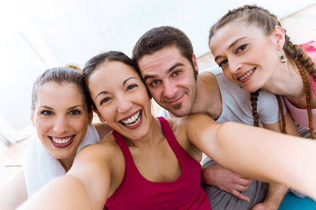 Group of people taking a selfie after yoga session.