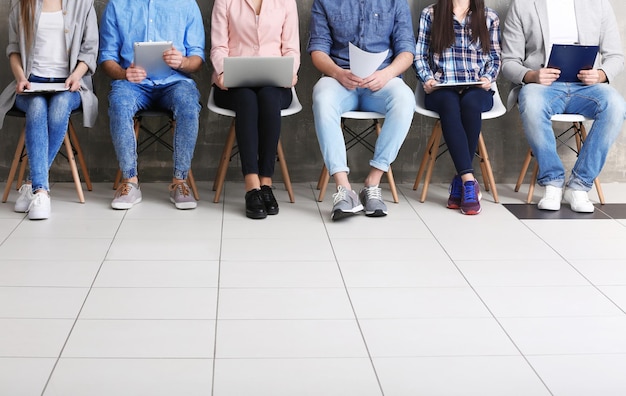 Group of people waiting for job interview in office hall