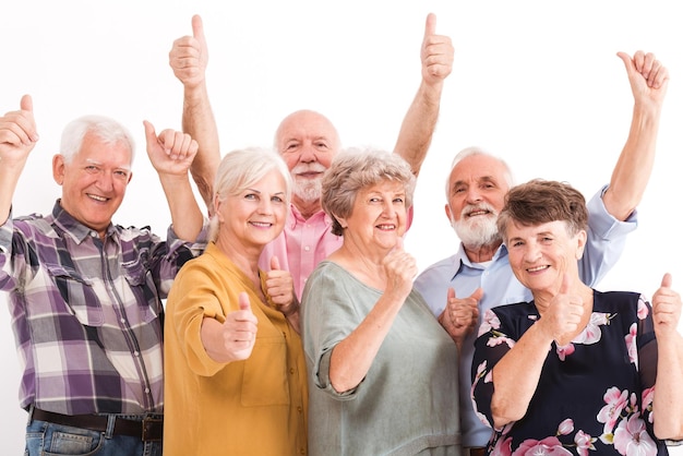 A group of people with thumbs up on a white background