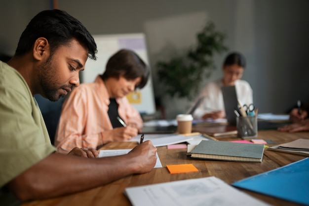 Group of people working on a business plan together in an office