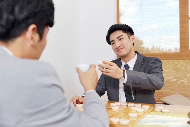 Group of people working out business plan in house tea