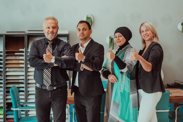 Group portrait of happy diverse colleagues of different ages. United businesspeople of 30s and 50s looking at camera. Team of trainee interns and coaches posing together in office. Teamwork concept.