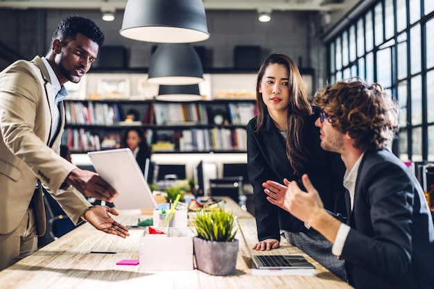 Group of professional business meeting and discussing strategy with new startup project.Creative business people planning and brainstorm with laptop computer in modern workloft.Teamwork concept