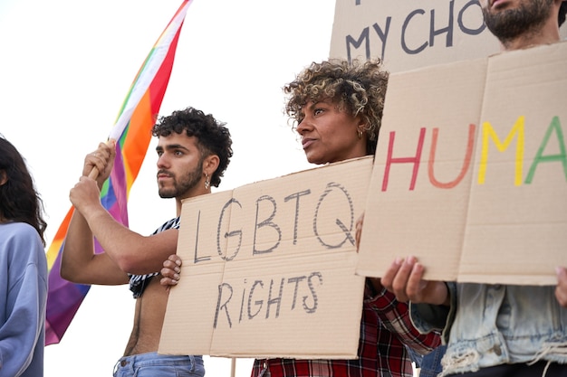 Group of protestors holding demonstrators banners gay pride lgbt community