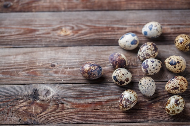 Group of quail eggs on thewooden background