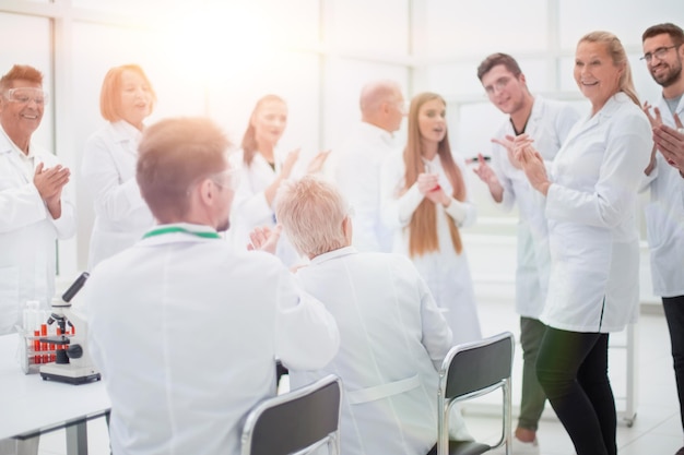 Group of researchers discussing new ideas in the laboratory