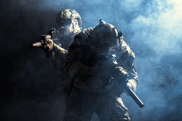 Group of security forces in Combat Uniforms with rifles