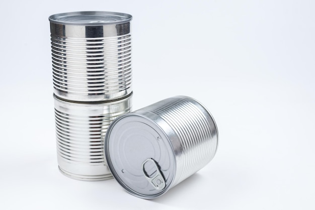 Group of silver canned food on white background