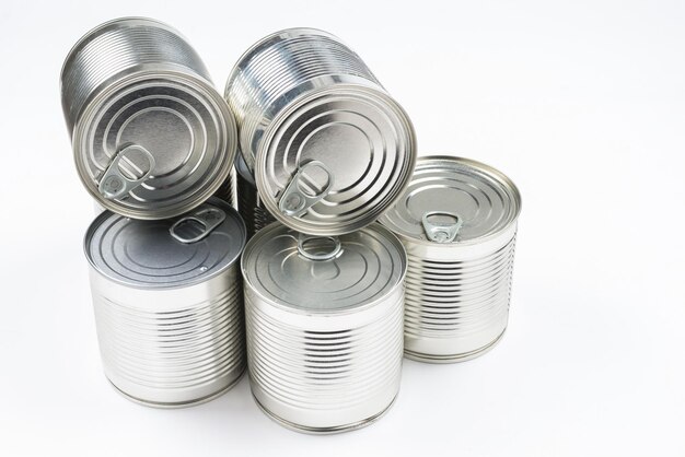 Group of silver canned food on white background