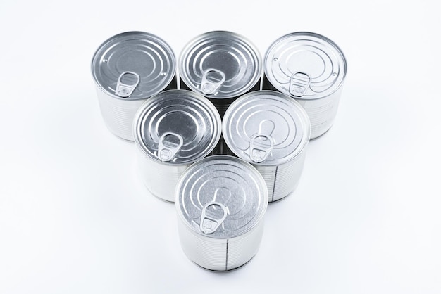 Group of silver canned food on white background