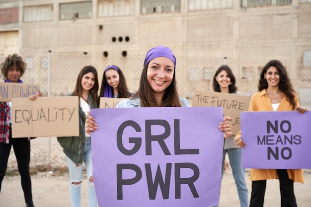 Group of smiling people activist protesting feminist women happy demonstration