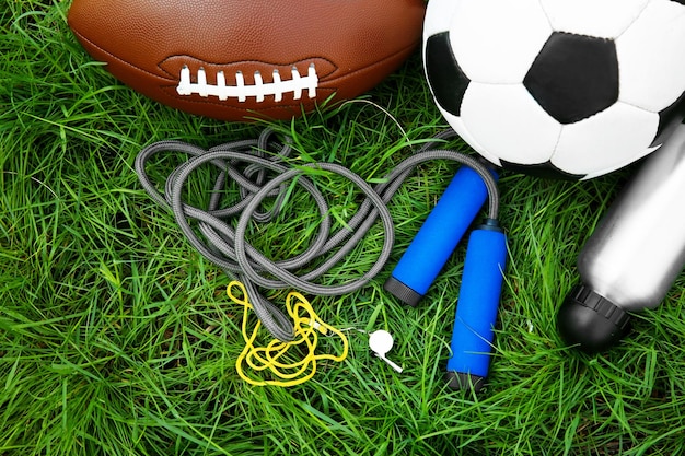 Group of sport equipment on green grass