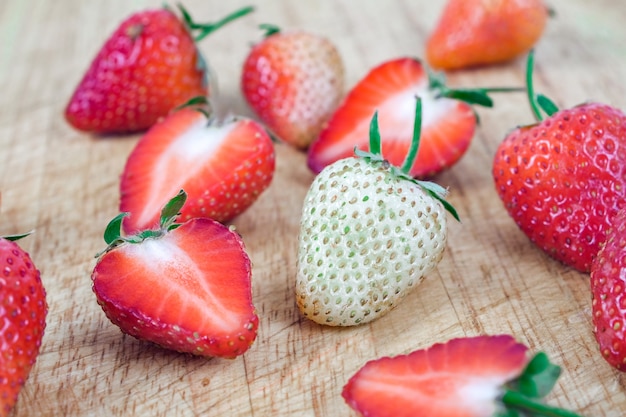 Group of Strawberries on wood background.