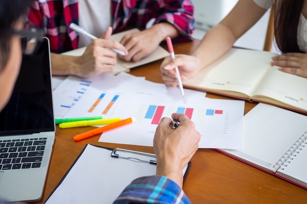 Group of students are learning and studying statistical data in mathematics in the university classroom