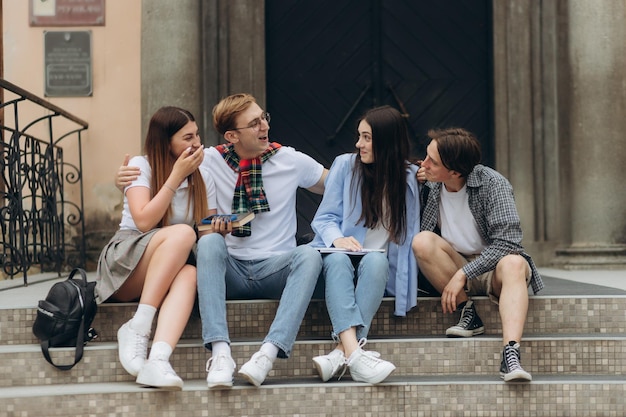 A group of students are talking on the street