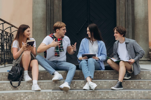 A group of students are talking on the street