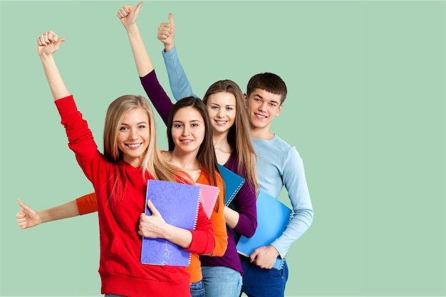 Group of students gesturing thumbs up on