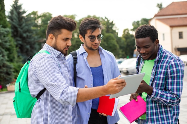 The group of students help your classmate with navigation