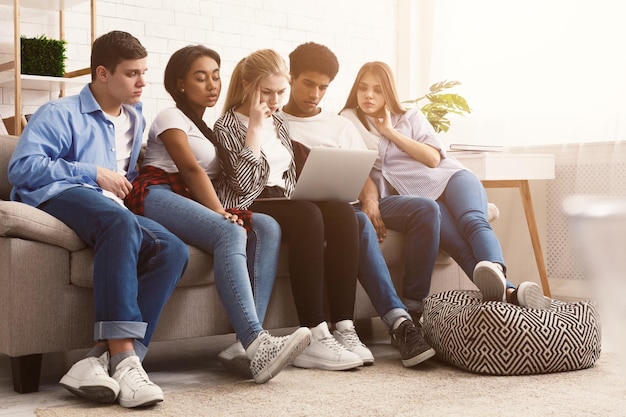 Group of students preparing for exams in apartment interior