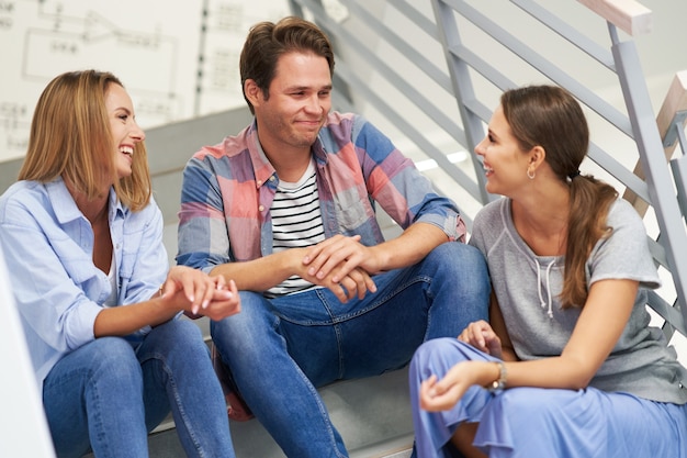 group of students relaxing in the campus