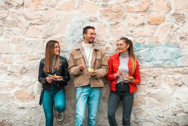 A group of students takes a break from college to rest and talk and eat delicious sweetsSelective focus High quality photo