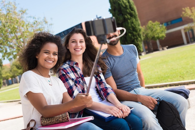 Group of students taking a selfie in school campus