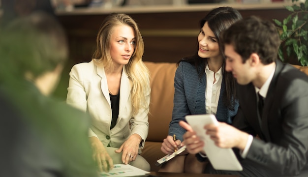 A group of successful businessmen. Discussion of the important contract of the company.