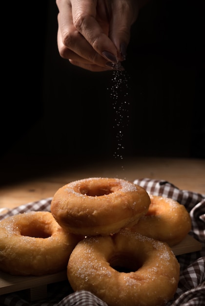 Group of sugar donuts on table