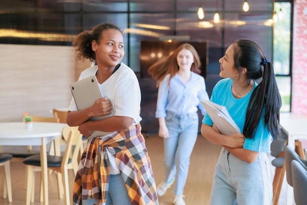 Group of teenager student walking to leaning in library of school University Library education and Student Learning concept