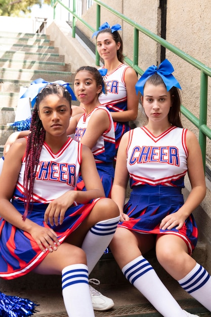 Group of teenagers in cheerleader uniforms