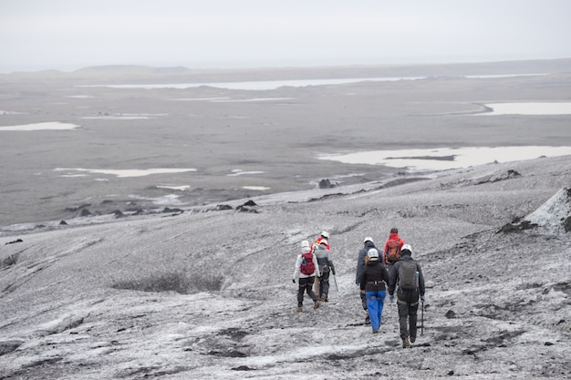 Group tour walking to glacier walking at langjokull glacier in Iceland