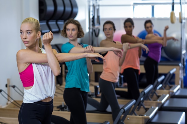 Group of women exercising on reformer