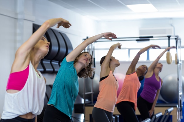 Group of women exercising on reformer