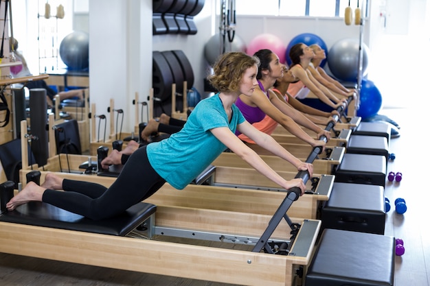 Group of women exercising on reformer