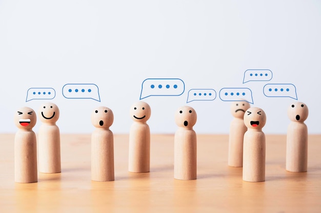 Group of wooden figure with comment message box cloud for customer feedback or group discussion for problem solving concept