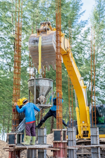 Group of worker pouring a concrete at construction site