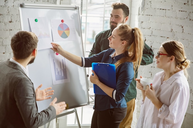 Group of young business professionals having a meeting, creative office