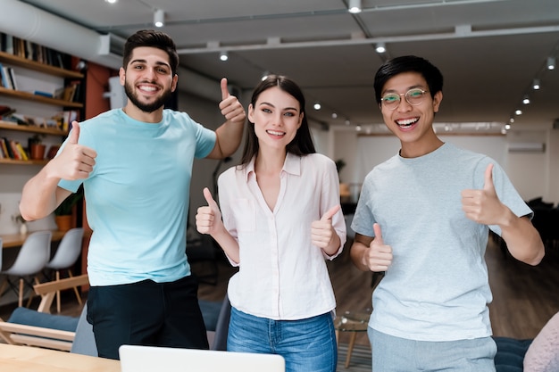 Group of young diverse people smiling in the office