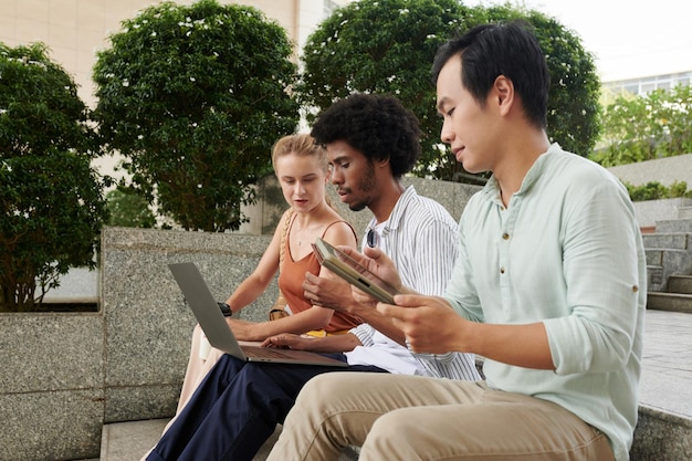 Group of young entrepreneurs meeting outdoors to discuss new project development