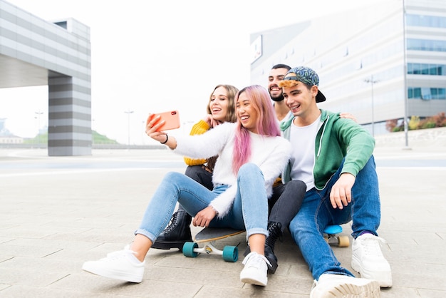 Group of young friends taking a selfie in the city