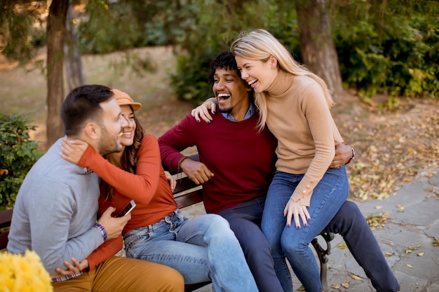 Group of young multiethnic friends having fun at park