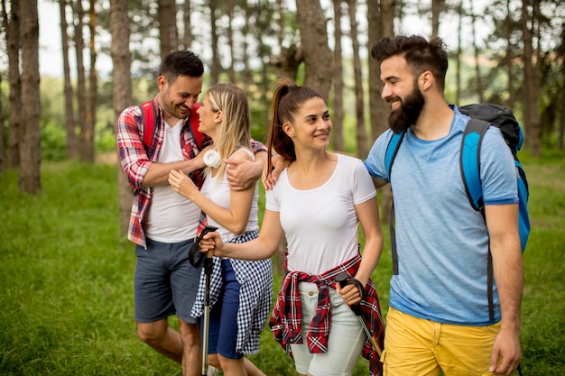 Group of young people are hiking in mountain at spring day