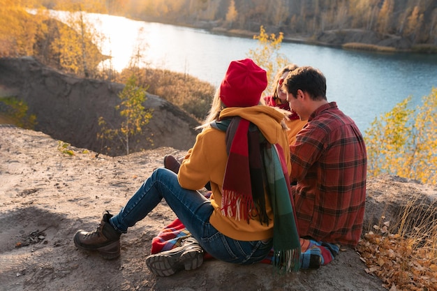 The group of young people are resting in nature